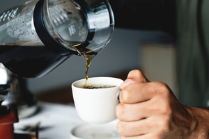 highest caffeine amount coffee pouring into mug